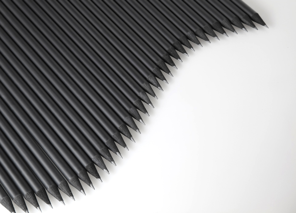 plenty of black pencils in the shape of a wave