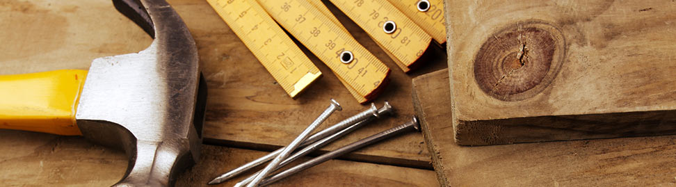 wooden folding rule with other tools on wood
