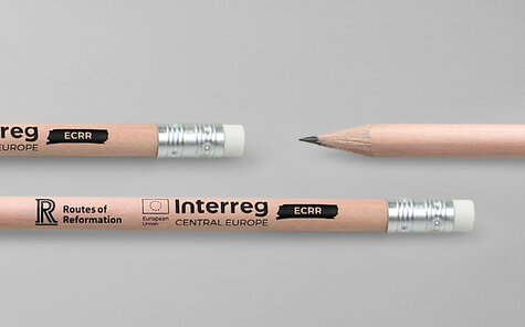 round natural pencil with black imprint and white eraser