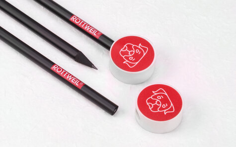 round eraser pencil topper on black matt pencils with two colored imprint | Reidinger.de