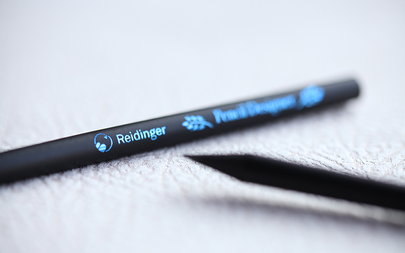 blue foil stamping on black pencils