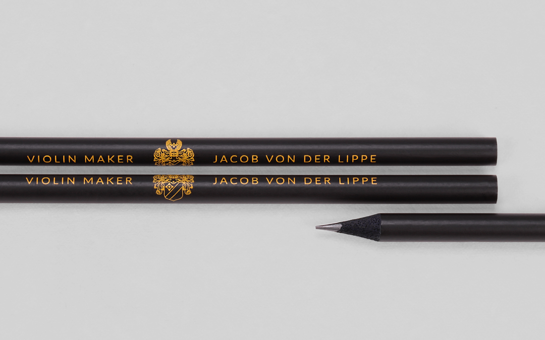 Black matt pencil with detailed printing motif in yellow