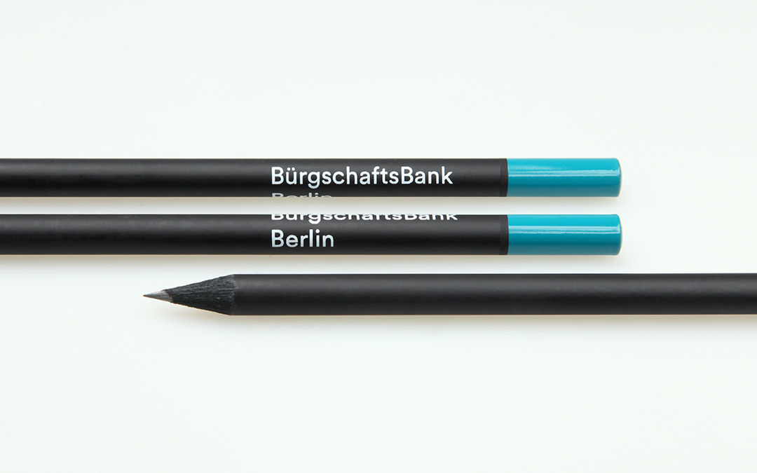 black pencil with lacquered cap and white imprint
