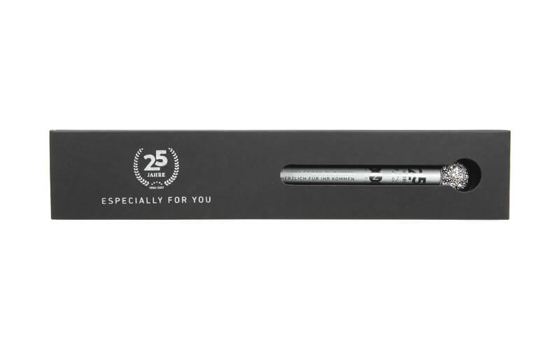 single packaging, with silver imprint on the cardboard and Glamour pencil