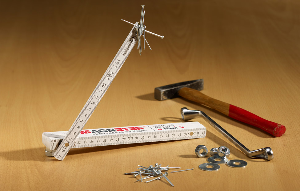 magnetic folding rule on a table with different utensiles