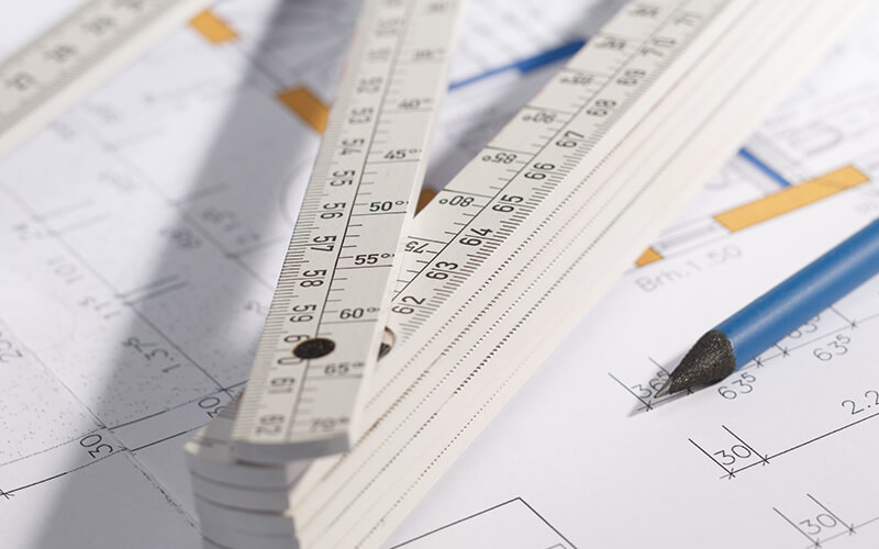 magnetic folding rule on a plan with a pencil