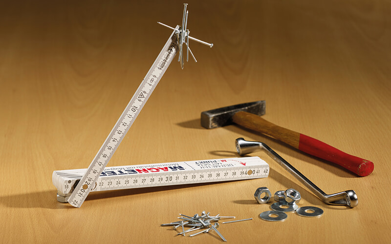 folding rule with magnet on table with tools
