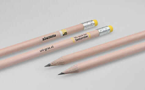 round natural pencil with yellow eraser and multicolored screen printing