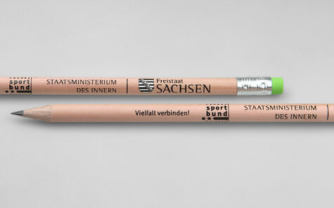 round natural pencil with green eraser and two colored imprint