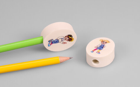oval eraser pencil topper with print on both sides, boy and girl motiv