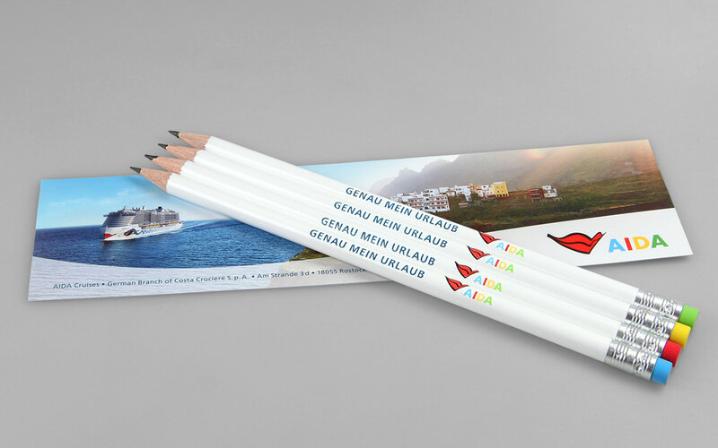four pencils with different erasers and bookmark 