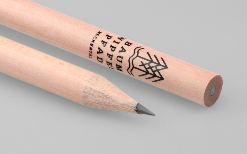 black imprint on round natural pencil